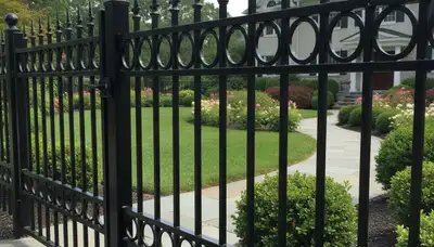 Black ornamental metal fence with decorative design by Chop Chop Landscaping in Cherry Hill, NJ